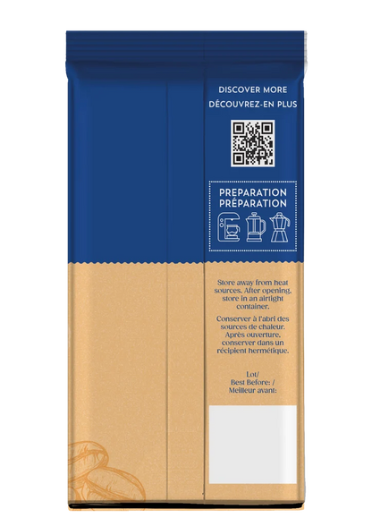 A vertical coffee bag with a blue top section and a kraft-paper style lower section, shown on a plain white background. The front includes a QR code, French text reading 'DISCOVER MORE' and 'PREPARATION PREPARATION', and a small white label area near the bottom.